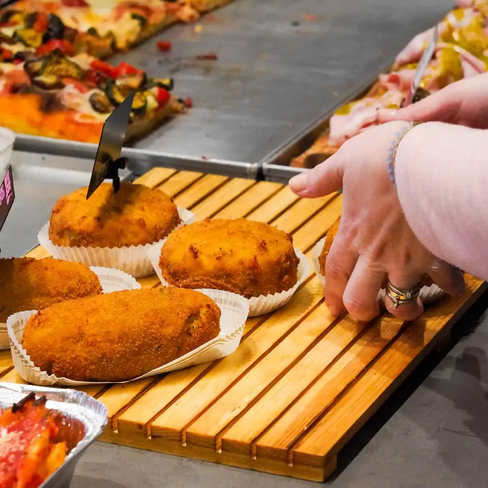 Arancini and crocchè on the counter