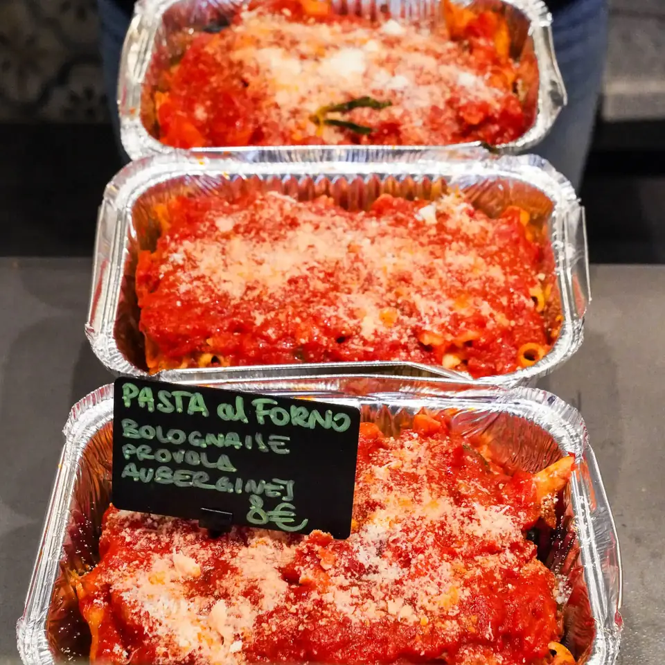 Takeaway trays of pasta al forno